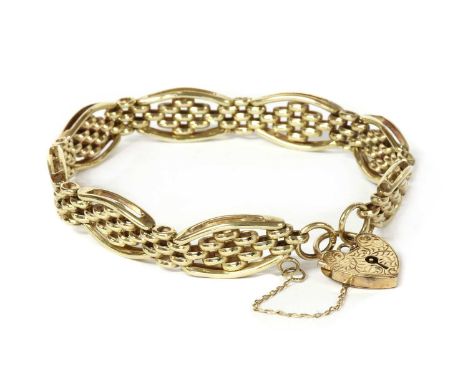 A 9ct gold gate bracelet, with curved outer bars and inner brick links, to heart shaped padlock clasp and safety chain, Sheff
