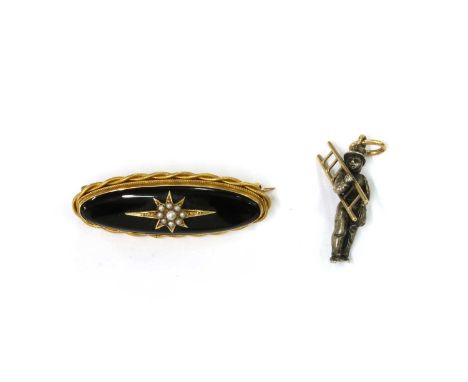 A Victorian gold onyx and split pearl brooch, with an elongated oval cabochon onyx, rub set, with an applied star collet grai