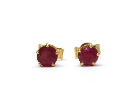 A pair of 18ct gold single stone ruby stud earrings, with a circular mixed cut ruby, approximately 4.8mm and 5.0mm in size, c