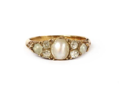 A Victorian gold split pearl and diamond ring, a split pearl, with a pair of old brilliant cut diamonds and a smaller split p