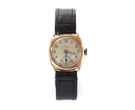 A mid-size 9ct gold mechanical strap watch, the cushion shaped case 28mm diameter, with a silvered dial marked Camerer Cuss &