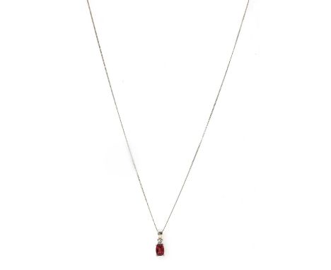 An 18ct white gold ruby and diamond pendant, with a cushion mixed cut ruby, approximately 5.5 x 4.0mm, surmounted by a brilli