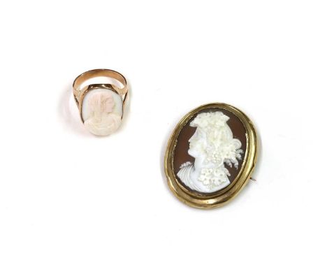 A Victorian gold mounted shell cameo brooch, depicting a bacchante in white to a brown ground, set to a plain frame, with cur