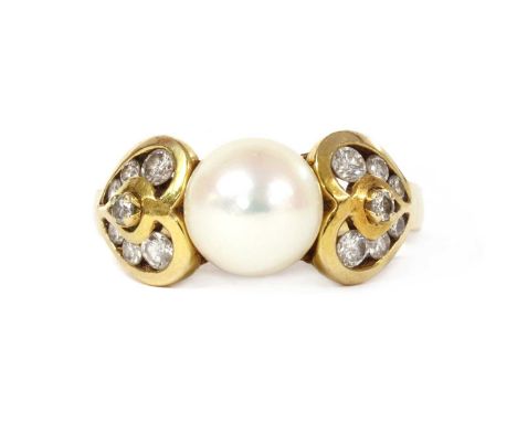 A gold cultured pearl and diamond ring, with a cultured pearl, 8.4mm in size, peg set to the centre, to heart motif shoulders