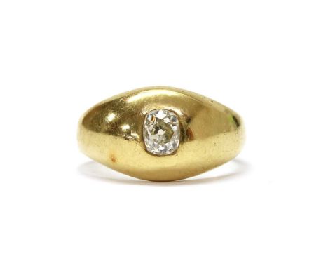 A late Victorian gold single stone diamond ring, with an old cushion cut diamond, rub set to the domed, tapered head, to a pl