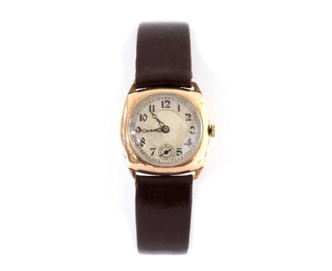 A 9ct gold cushion shaped mechanical strap watch, 28mm diameter with a silvered dial, Arabic numerals, blued hands and subsid