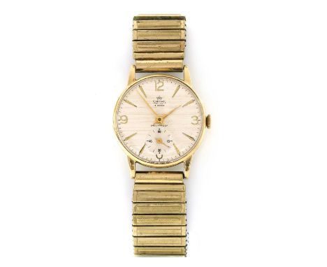 A 9ct gold Smiths 'Deluxe' mechanical bracelet watch, 31mm diameter with a silvered striated dial, baton hour markers with Ar