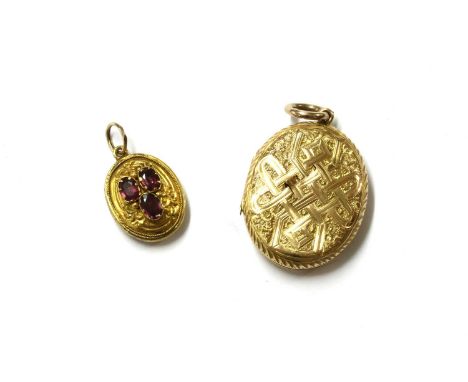 A gold oval locket, with hand engraved decoration, splits to front, with later bolt ring to suspension ring, tested as approx