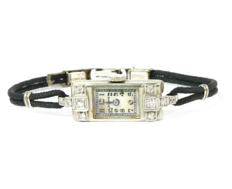 An Art Deco Canadian ladies' white gold diamond set cocktail watch, by Birks, rectangular case, 23 x 10mm, with silvered dial