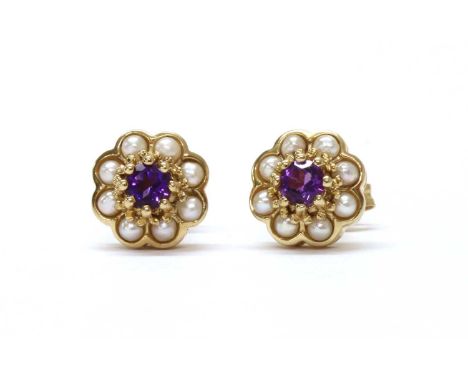 A pair of 9ct gold amethyst and split pearl cluster earrings, by Luke Stockley Jewellery, a circular mixed cut amethyst, claw
