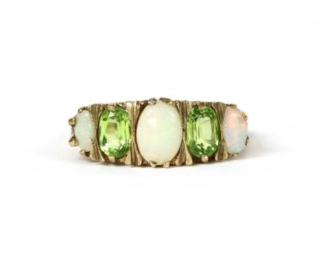 A 9ct gold opal and peridot ring, with a graduated row of oval cabochon opals and oval mixed cut peridots, claw set to the sc