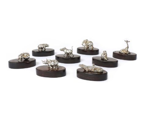 A set of eight silver animal place card holders, by Patrick Mavros, to include a warthog, a giraffe, a hippopotamus, an eleph