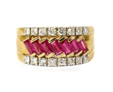 A gold ruby and diamond ring, a row of rectangular step cut rubies, end set at a diagonal, to guards grain set with brilliant