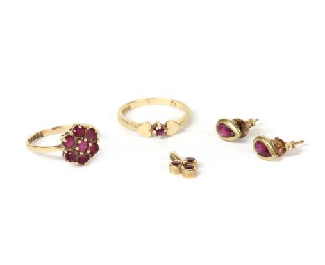 A quantity of gold ruby set jewellery, to include a 9ct gold single stone ring with heart motif shoulders, possibly London, a