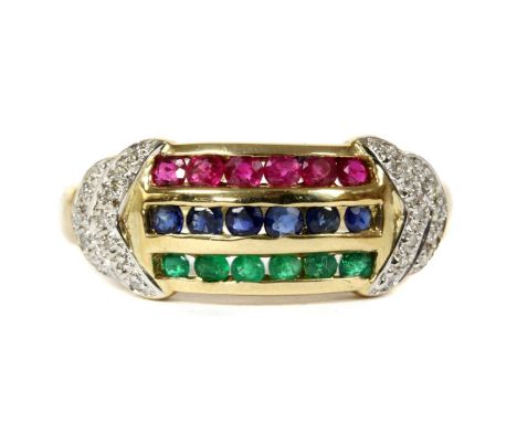 A 9ct gold ruby, sapphire, emerald and diamond ring, with three rows of channel set circular mixed cut rubies, sapphires and 