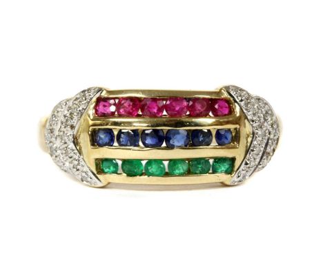 A 9ct gold ruby, sapphire, emerald and diamond ring, with three rows of channel set circular mixed cut rubies, sapphires and 