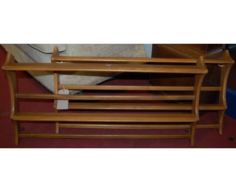 A pair of Ercol light elm two tier open plate racks 