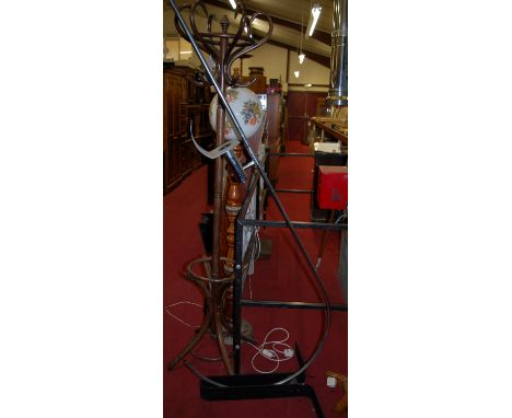 A 1960s probably Italian tubular chrome standard lamp, of lower curved form, having adjustable rotating integral shade, on bl