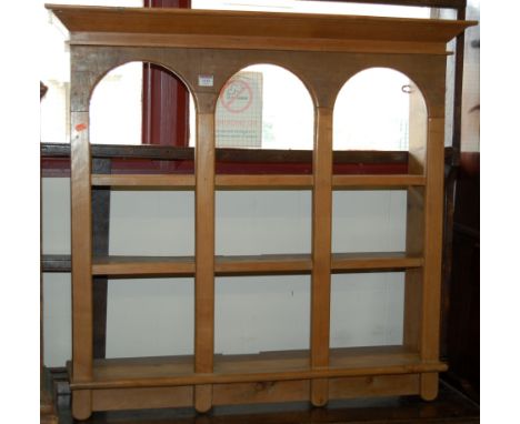 A modern pine three tier hanging wall shelf; together with a rustic green painted pine bookshelf of small proportions (2)