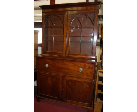 A 19th century mahogany secretaire bookcase, the upper section having twin astragal glazed doors enclosing adjustable shelves