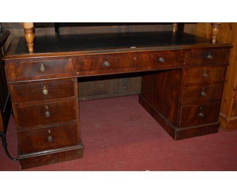 A Victorian mahogany round cornered and rexine inset twin pedestal writing desk, having turned brass handles, w.153cm  Condit