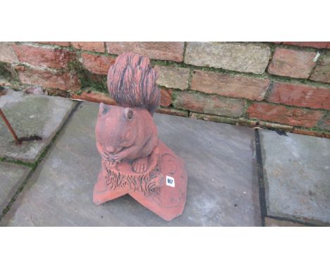 A roof ridge finial of a squirrel on a 90 degree tile - Width 24cm x Depth 18cm x Height 41cm 