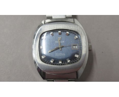 TISSOT. Seastar. 35mm.  Automatic. 1970's. S/steel with blue dial, sweep second hand and date at 3.Original bracelet. Working