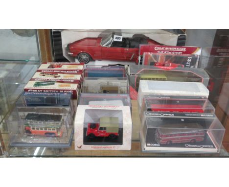 A 1964 Ford Mustang 1:12 scale diecast model car together with others 