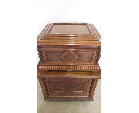 A Nicole Freres polyphon plays 16 inch discs in a good quality burr walnut case with marquetry to the top together with 22 di