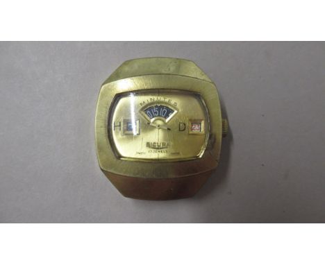 SICURA.1970'S jump hour manual digital. Gold case. 35mm. 17 jewels. Working in saleroom 