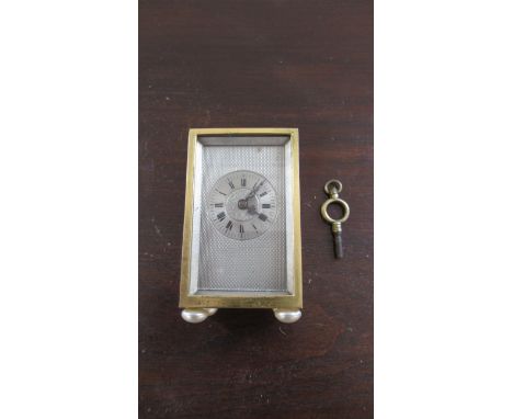 A small brass travelling clock for restoration - Height 7cm 