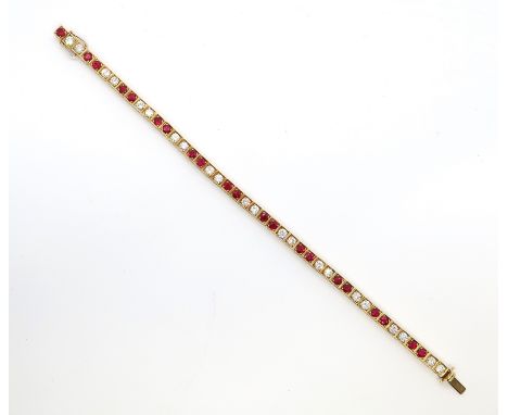 A diamond and ruby tennis bracelet set in 18ct (hallmarked) yellow gold - 22 round brilliant cut diamonds set in pairs divide