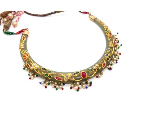 A 'Mughal' style Jade and precious stone necklace, Celadon Jade arc inlaid with yellow gold and set with rubies, opals, coral