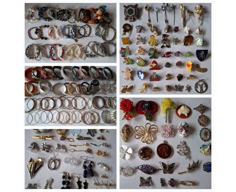 A large quantity of modern costume jewellery, vintage buttons and small collectables to include novelty and charity pin badge