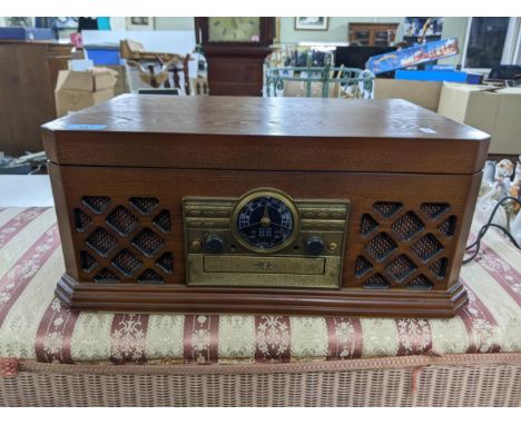 An unused Zennox model D3939 turntable with CD player, cassette player, analog tuning, AM/FM radio and record to PC function,