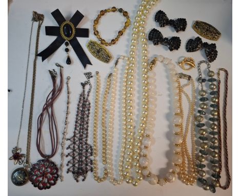 A quantity of costume jewellery to include simulated pearl necklaces, brooches, an Ingersoll stopwatch, a pair of Jewelcraft 