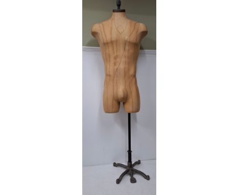An American Fusion USA tan calico shop mannequin/torso in male form on an adjustable cast metal base in the mid 20th Century 