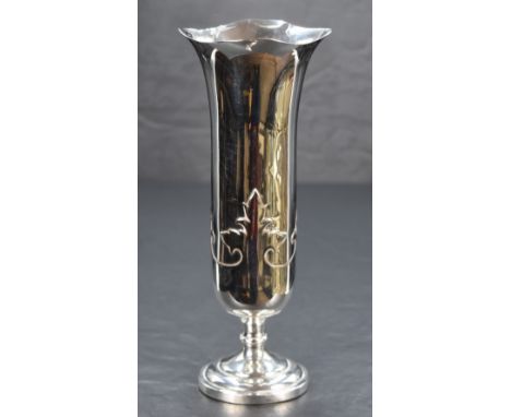 A George V silver vase of flared cylindrical form with lobed rim, foliage strapwork below raised on a short knopped stem and 