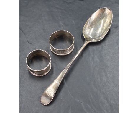 A George III silver serving spoon of Old English design, engraved 'MJ' to terminal, marks for London 1792, no visible makers 