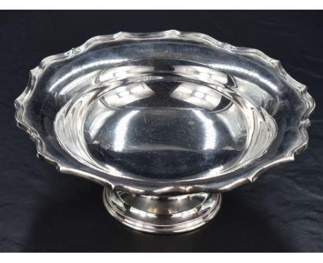 A George V silver pedestal dish of circular form with Chippendale influenced rim, marks for Chester 1919 and rubbed makers ma