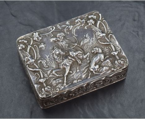 A late Victorian silver box of hinged rectangular form, the cover embossed with an Eastern hunting scene of a mounted archer 