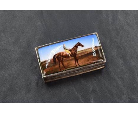 An Elizabeth II silver trinket box of hinged rectangular form, the cover having an enamelled image of a racehorse and jockey,
