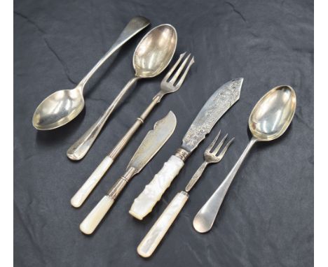 A selection of silver flatware and cutlery comprising a George V silver pickle fork with mother-of-pearl handle, marks for Sh