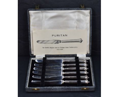 A set of six early Elizabeth II silver handled butter knives, having handles adapted from an antique Puritan design c.1654 of
