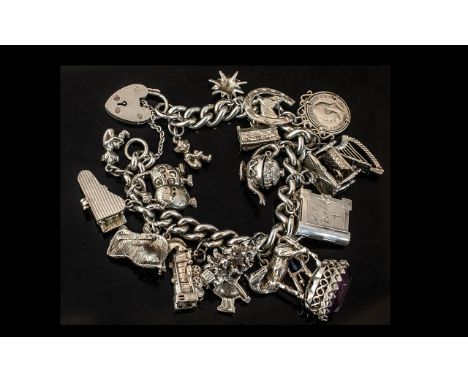 A Fine Vintage Silver Charm Bracelet Loaded with 18 Silver Charms. Both Bracelet and Charms Marked for Sterling Silver. Compr