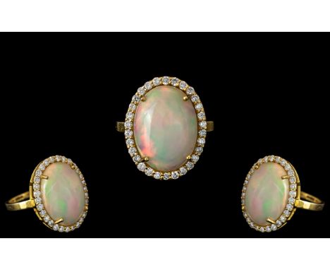 Ladies 14ct Gold - Large and Impressive Opal and Diamond Set Ring, Marked 585 to Interior of Shank. The Large Oval Shaped Opa