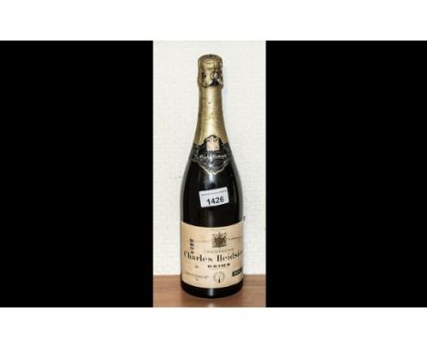 Bottle of Vintage Charles Heidsieck Reims Champagne, by appointment of His Late Majesty  King George VI. Rare item.  Together