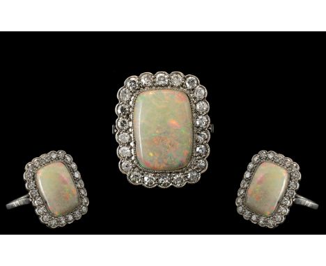 Antique Period - Platinum Set Superb Quality Diamond and Opal Set Dress Ring. The Rectangular Shaped Opal of Wonderful Colour