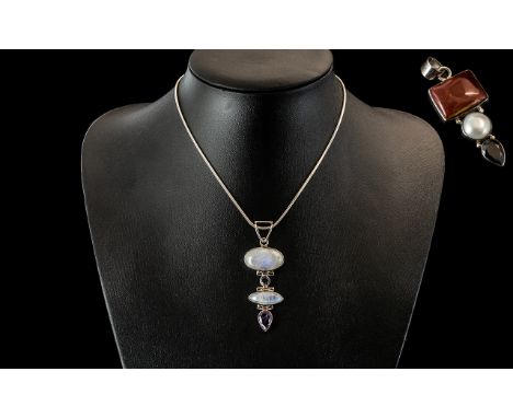 Two Hand Crafted Sterling Silver Pendants, comprising a Rainbow Moonstone and Amethyst articulated pendant on chain with a la