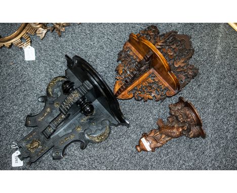 A Collection of Three Victorian Wall Brackets, to include a carved ebonised bracket, a Black Forest style carved bracket, and